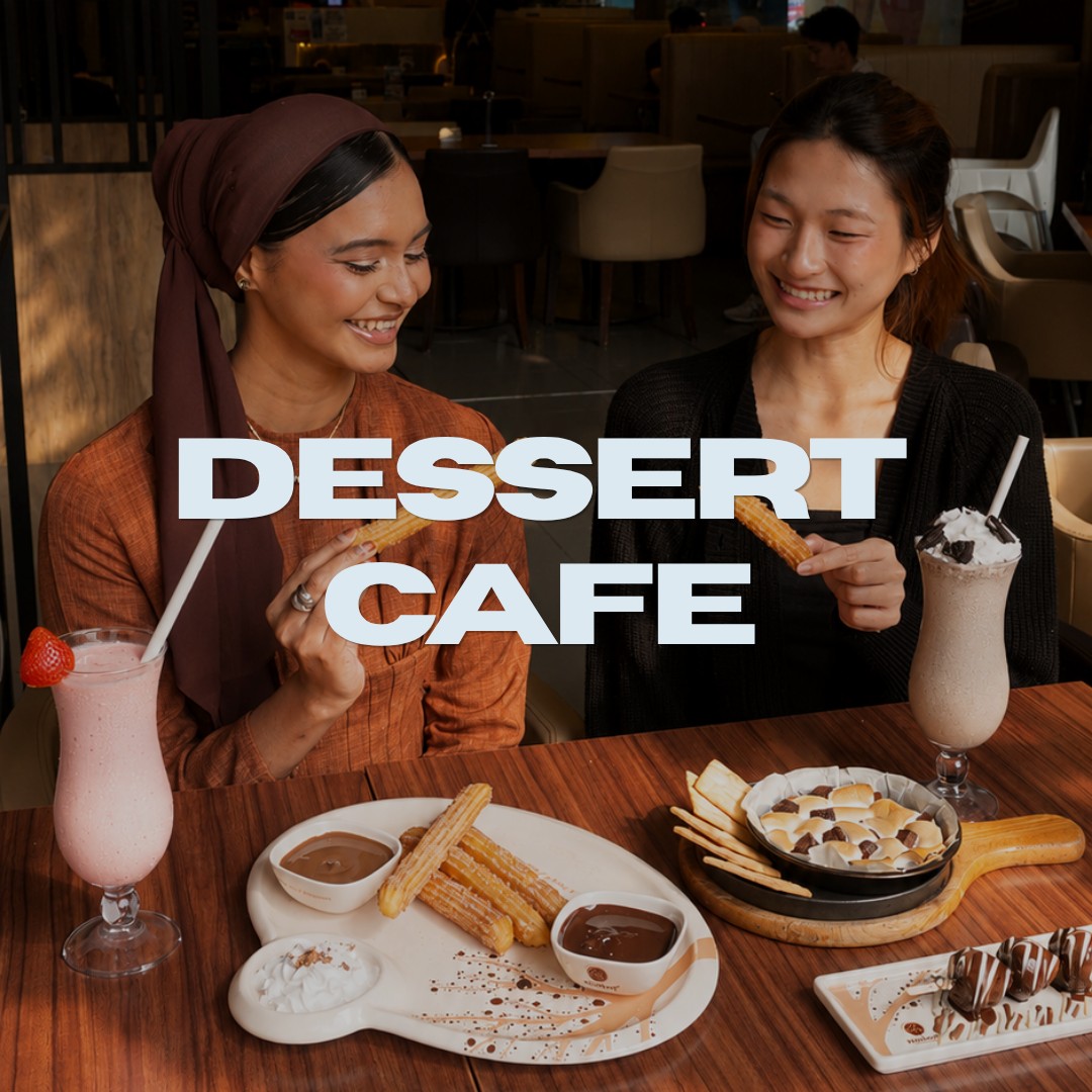 Dessert Cafe: two smiling women sharing churros, milkshakes and desserts at a cafe table, with the title 'Dessert Cafe'
